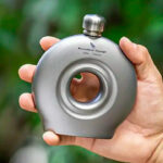 survival EDC gear flat lay showing a life-saving flashlight, multitool, and other essential everyday carry gadgets for emergency preparedness